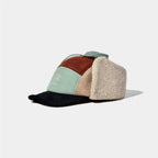 Sherpa lined corduroy winter hat featuring soft ear flaps and warm textured construction