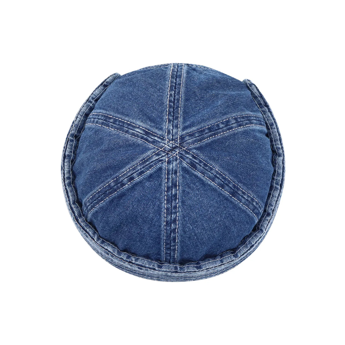 Six-panel denim hat in washed indigo, overhead view highlighting radial seams and the neatly stitched turn-up band