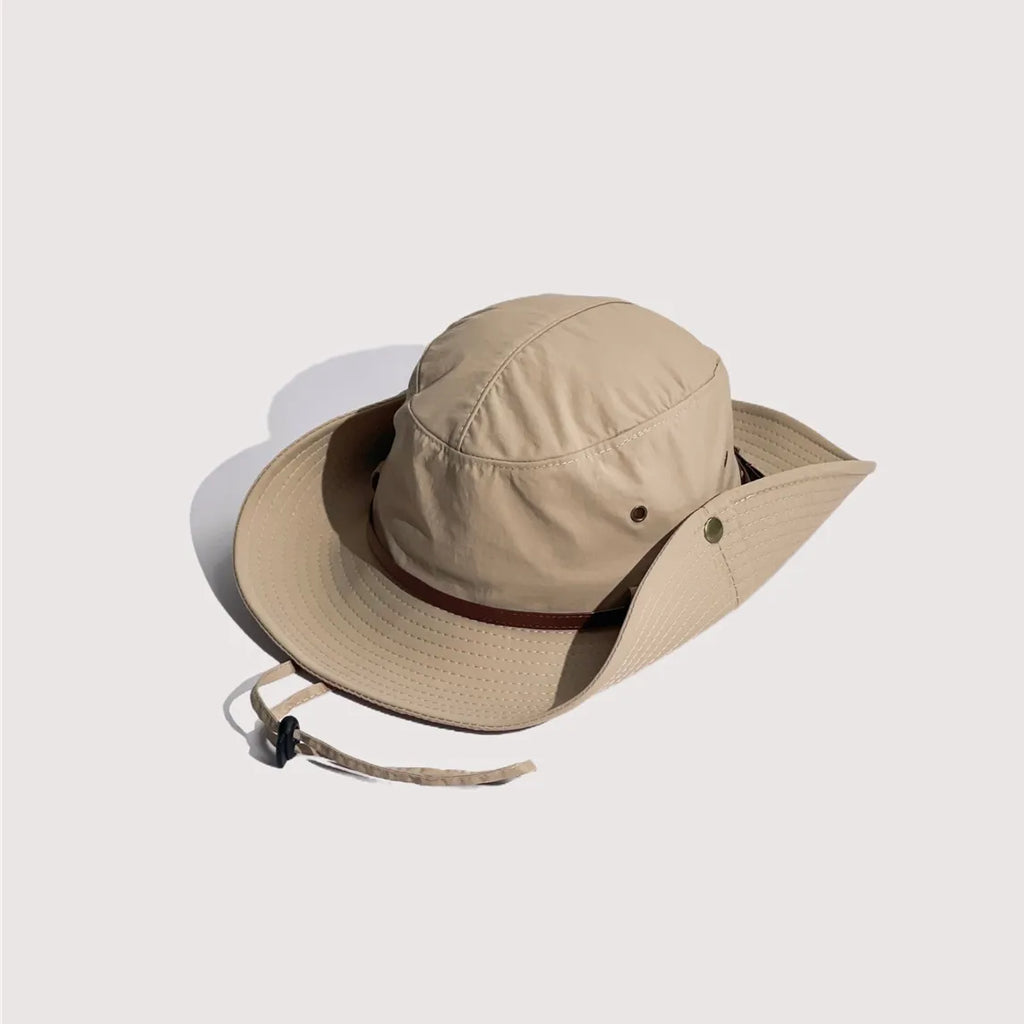 Snap-up brim safari hat in beige, angled view showing one side fastened to the crown with a metal stud