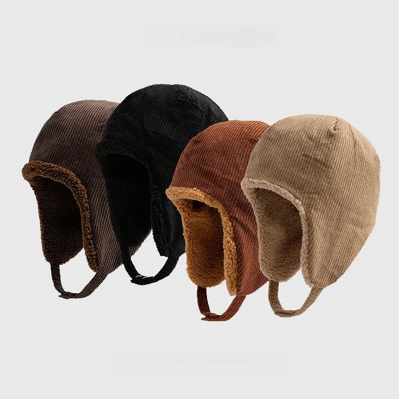 Corduroy trapper hat range in dark brown, black, rust brown and beige, with ear flaps and press-stud chin straps.