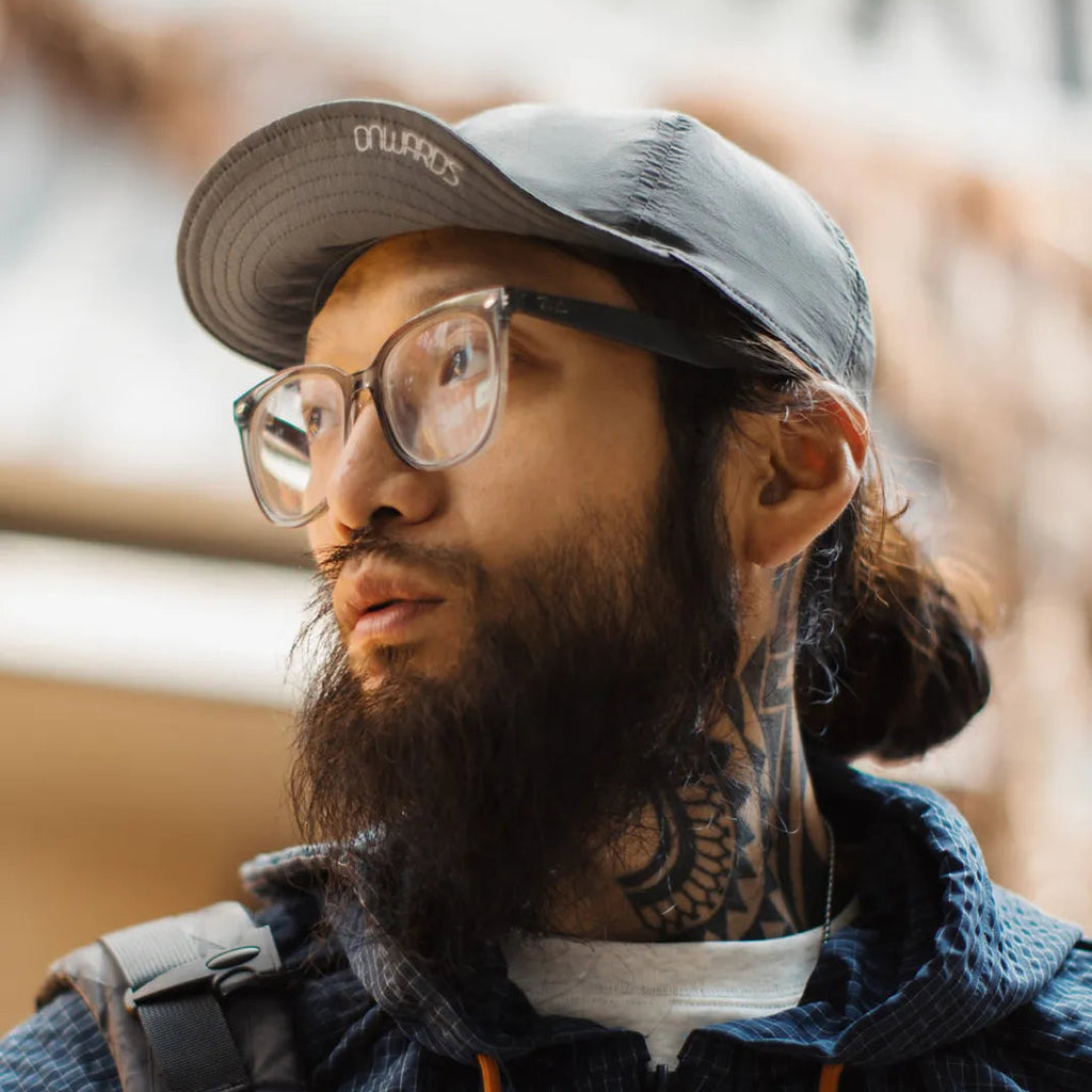 Lightweight nylon cap featuring curved brim and clean outdoor inspired silhouette