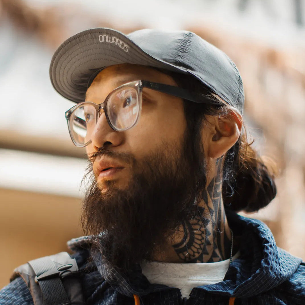 Lightweight nylon cap featuring curved brim and clean outdoor inspired silhouette