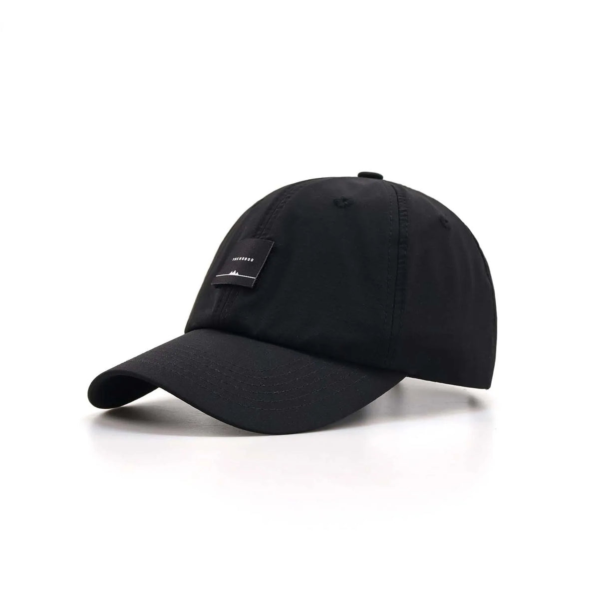 Unstructured baseball cap in black, angled front view with a curved peak and square woven label