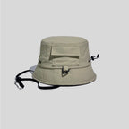 Utility bucket hat in khaki green, side view showing the flap pocket, D-ring loop and adjustable crown cord