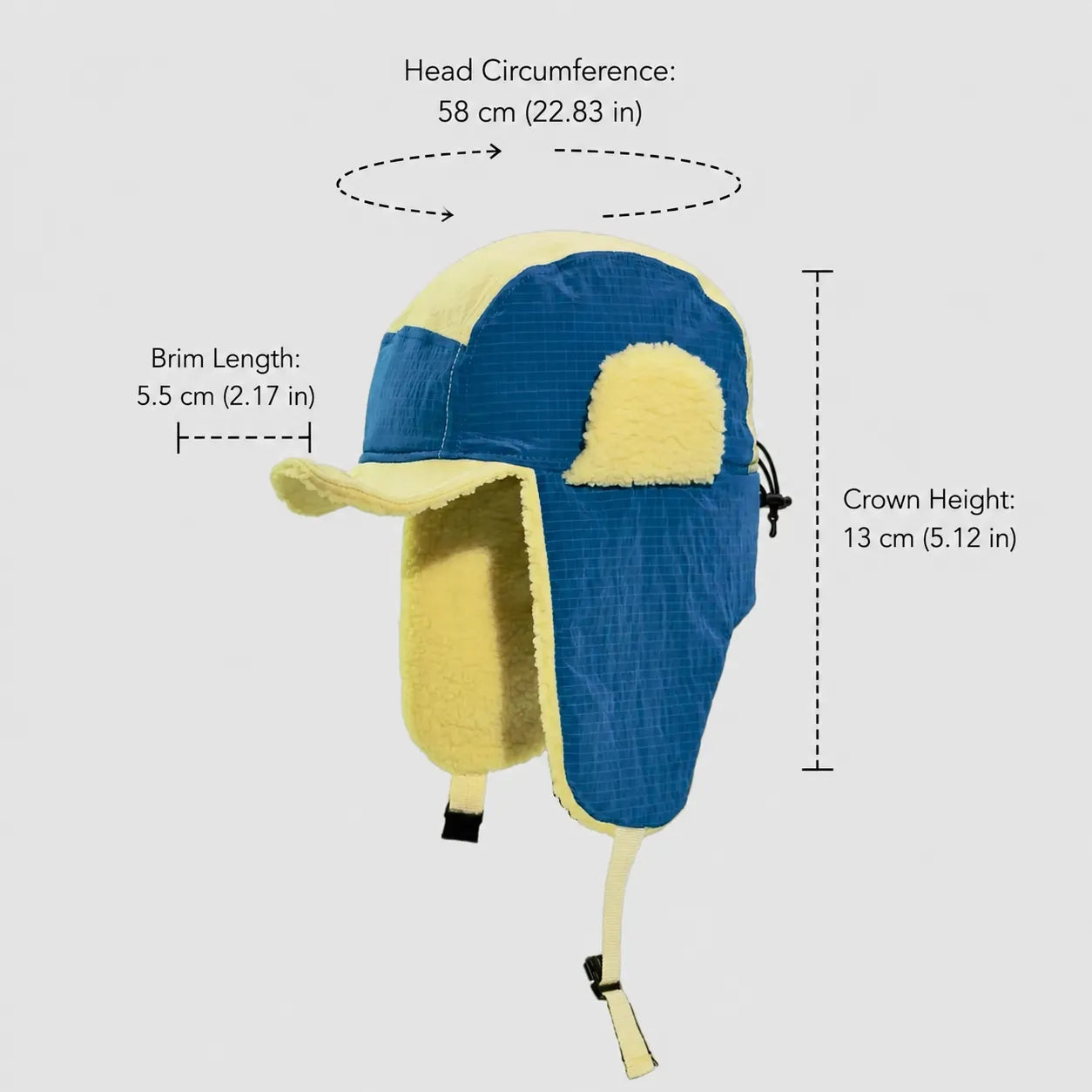 Blue and yellow waterproof nylon trapper hat size guide showing 58 cm head fit, 5.5 cm brim and 13 cm crown.