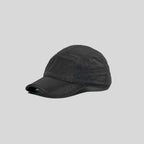 Waterproof running cap in black, angled side view showing the panelled crown, glossy texture and curved peak