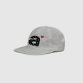 White 5 panel cap side view with clean nylon texture and embroidered decoration