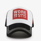 Front view of a white and black trucker cap with a red graphic patch, curved black brim and white contrast stitching.