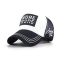 White and navy mesh trucker cap with a black WORE front graphic, curved brim, white contrast stitching and side embroidery.