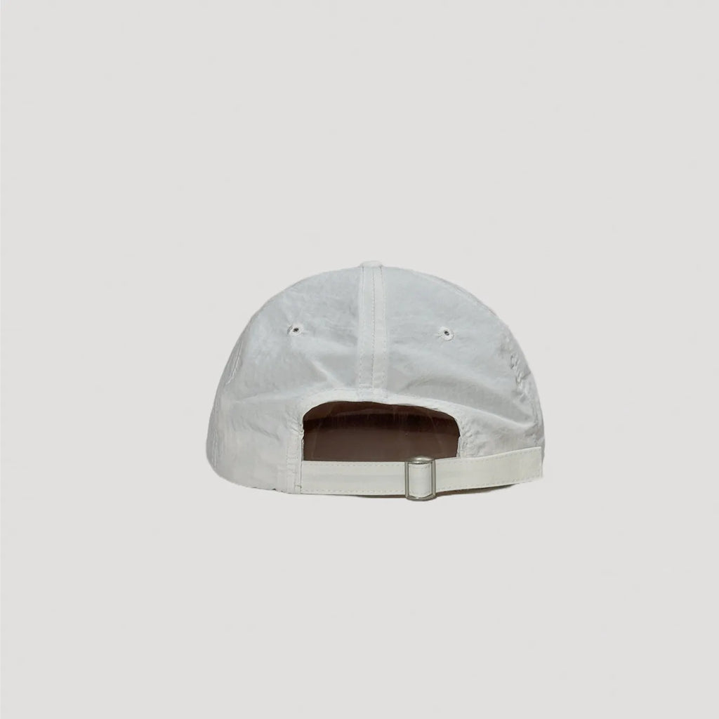 White nylon cap back view with adjustable strap and metal buckle closure