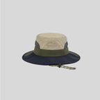 Beige wide-brim sun hat front view with olive band, navy brim, grey mesh panels and tonal mountain embroidery.