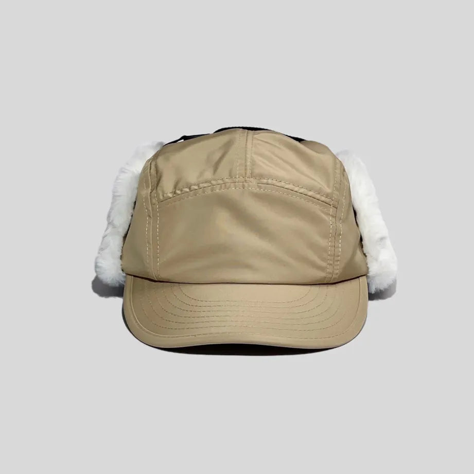 Winter baseball cap with ear flaps in khaki, front view with a panelled crown, curved peak and white plush trim
