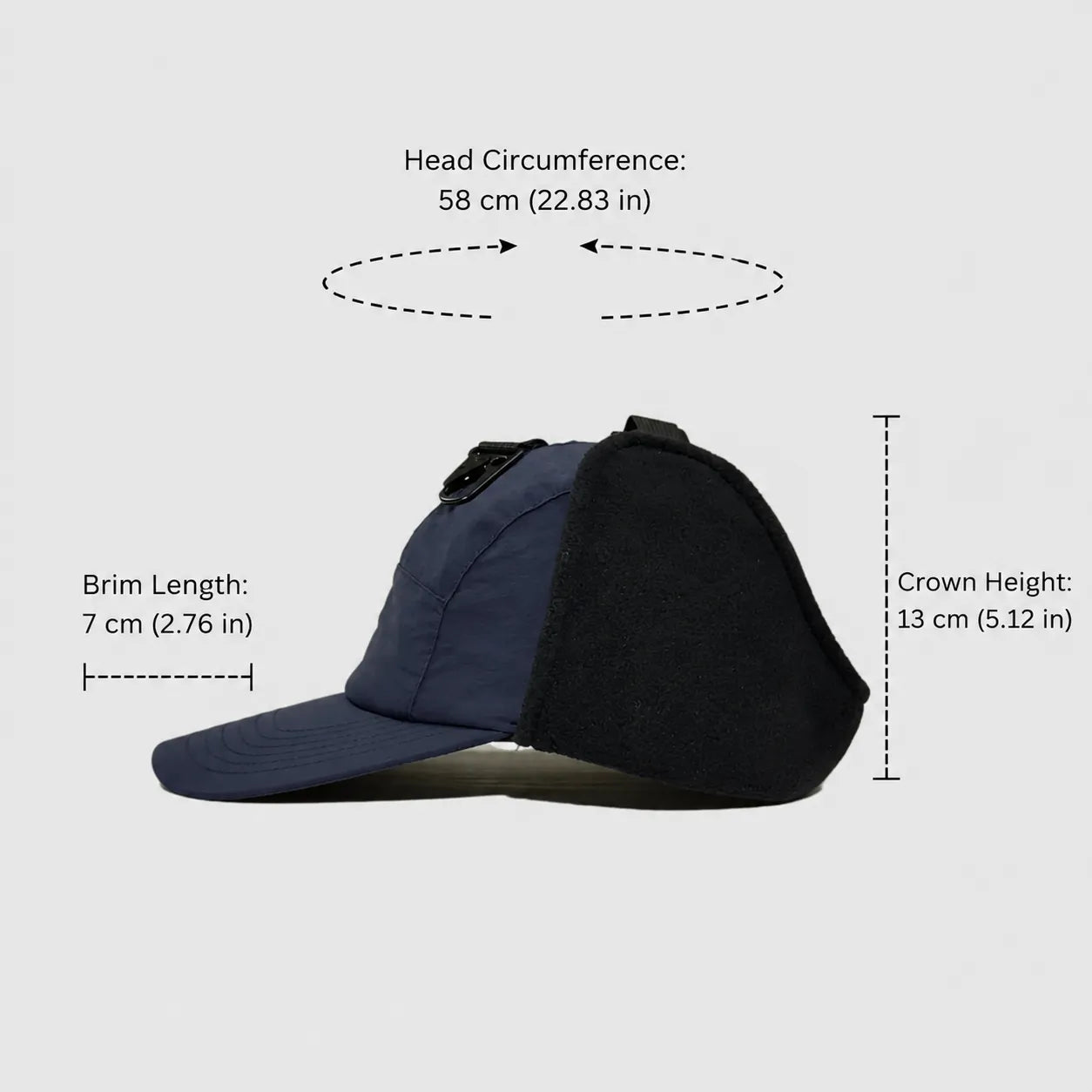 Navy and black winter ear flap cap side size view with curved brim, fleece panel and extended ear coverage.