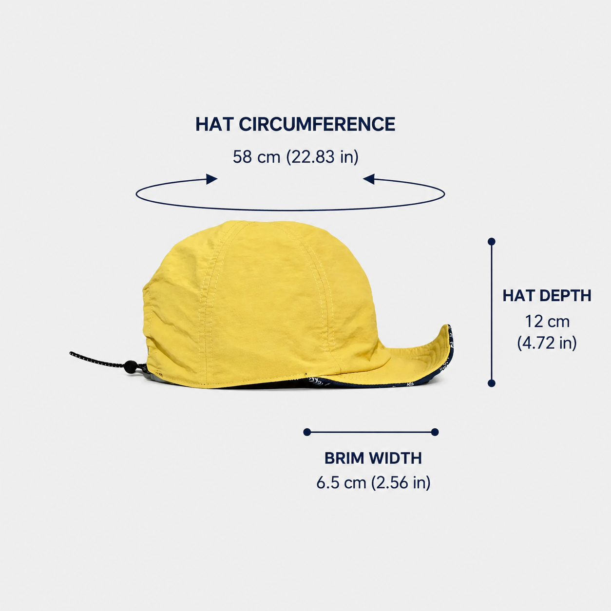 Size guide for a yellow cotton cycling cap with a paisley print short brim, showing a 58 cm circumference, 12 cm hat depth and 6.5 cm brim width.